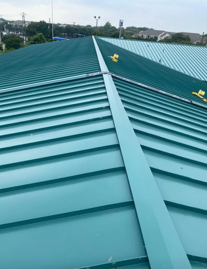 Green commercial metal roof ridge and valley for Metal Roof Repair in Milo